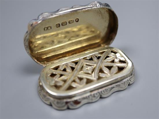 A Victorian silver shaped oval vinaigrette, engraved with the Scott Monument, Frederick Marsden, Birmingham, 1876, 47mm.